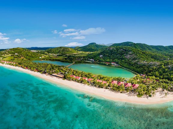 antigua barbuda frontier airlines the peninsula with sand