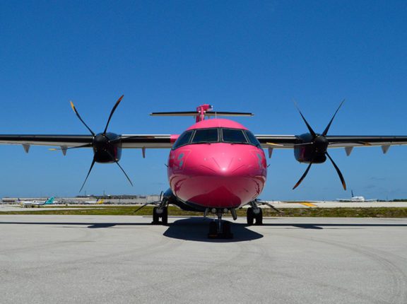 silver airways plane on the runway