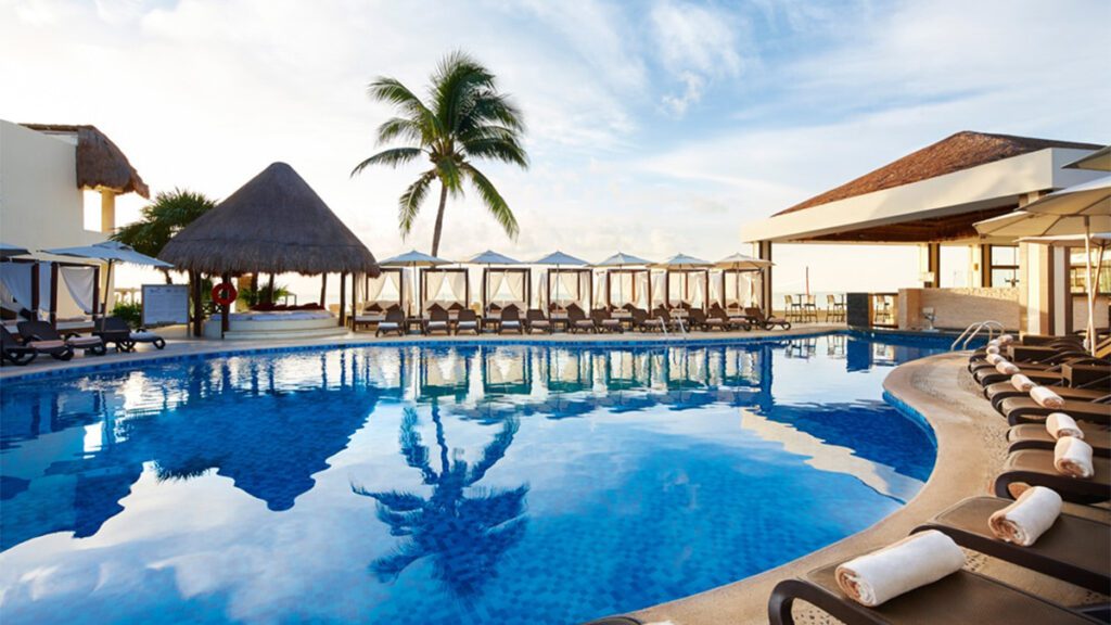all-inclusive riviera maya pool with palm tree