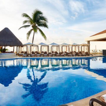 all-inclusive riviera maya pool with palm tree