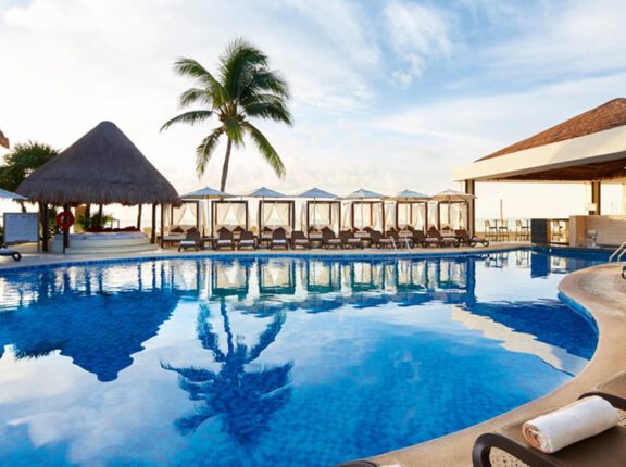 all-inclusive riviera maya pool with palm tree