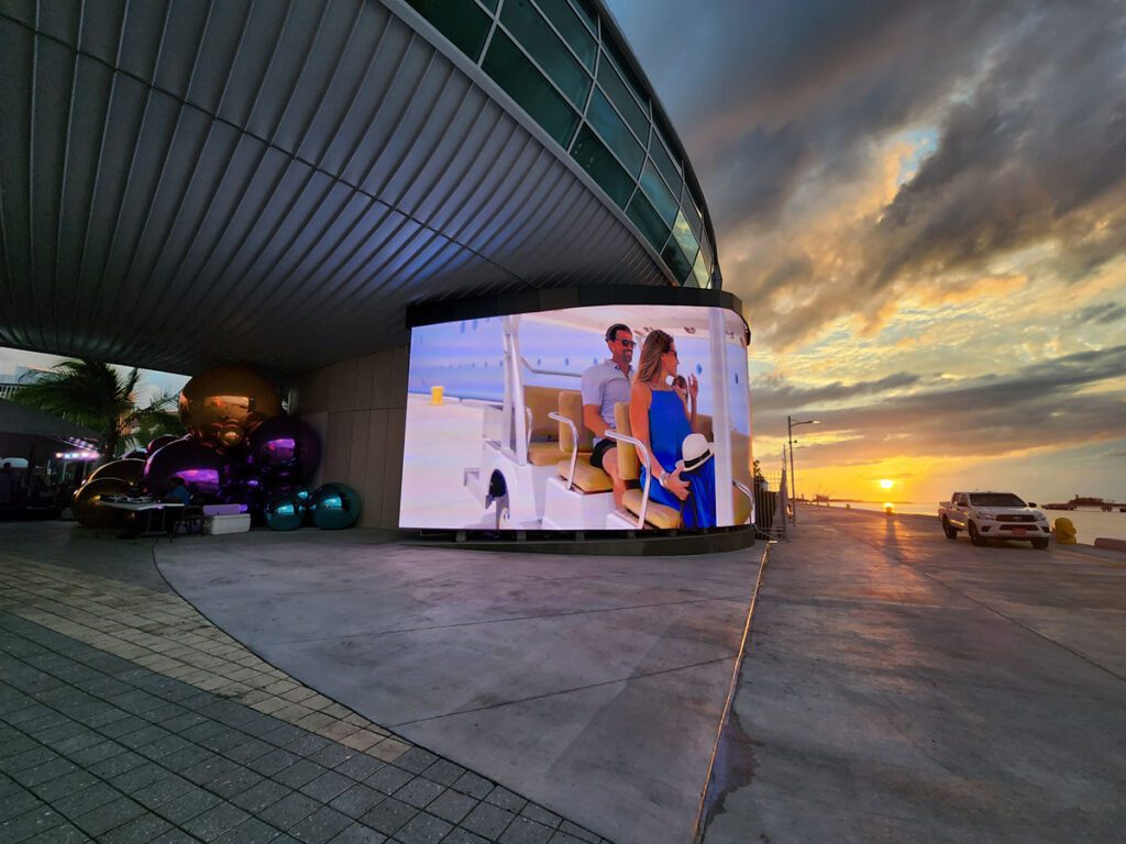 a digital wall with sunset in the background