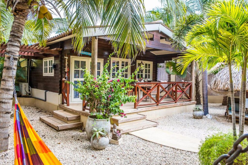 a cottage with palm trees