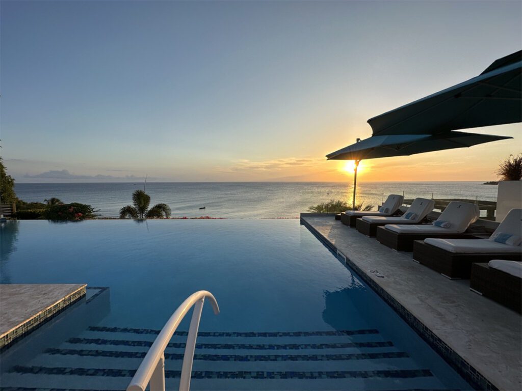 the pool at the hotel at sunset