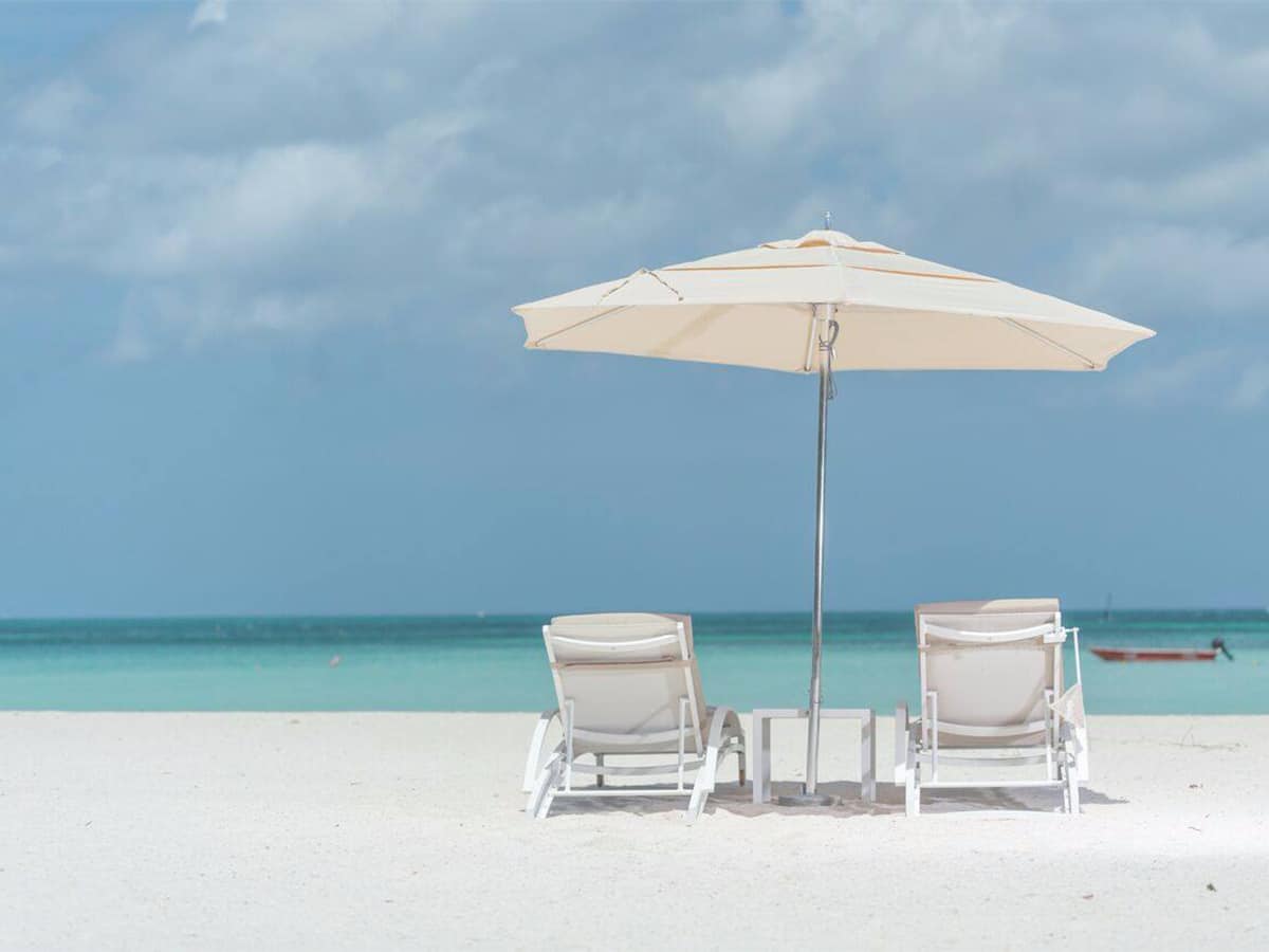 aruba ritz on the sand under umbrella