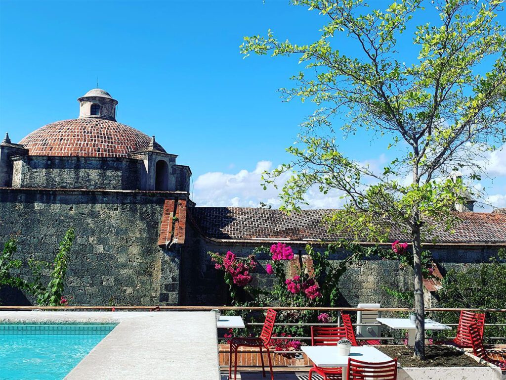 rooftop pool in santo domingo with building in background