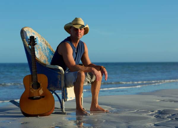 kenny chesney on the beach sitting