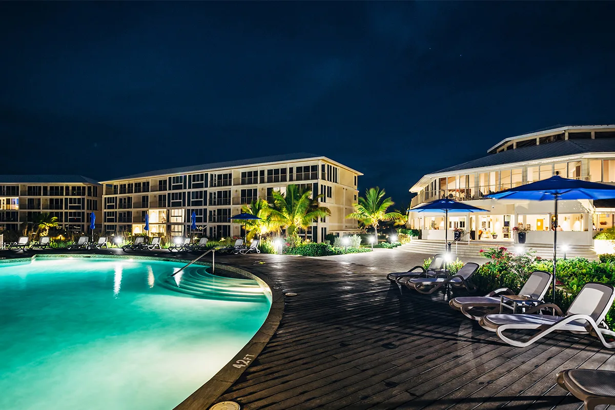 east bay resort by the pool at night