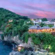 cap maison luxury resort with green hills in background