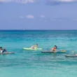 people floating on seven mile beach