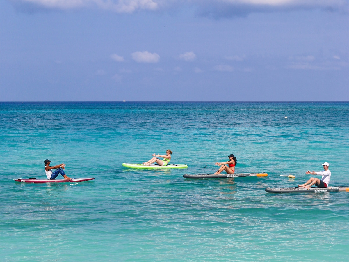 people floating on seven mile beach