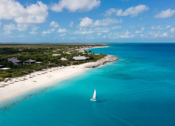 on the beach with sailboat in foreground