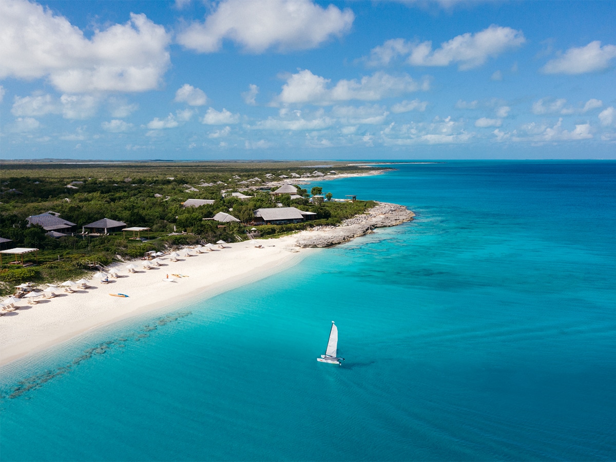 on the beach with sailboat in foreground