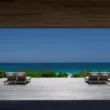 house with deck overlooking beach