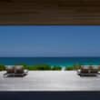 house with deck overlooking beach