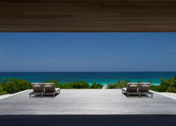 house with deck overlooking beach