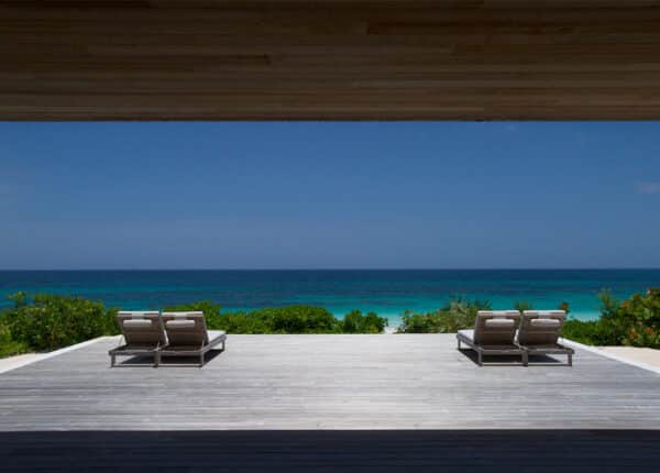 house with deck overlooking beach