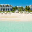 beach at palms resort with umbrellas