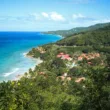 carambola resort with green hills and blue water