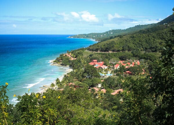 carambola resort with green hills and blue water