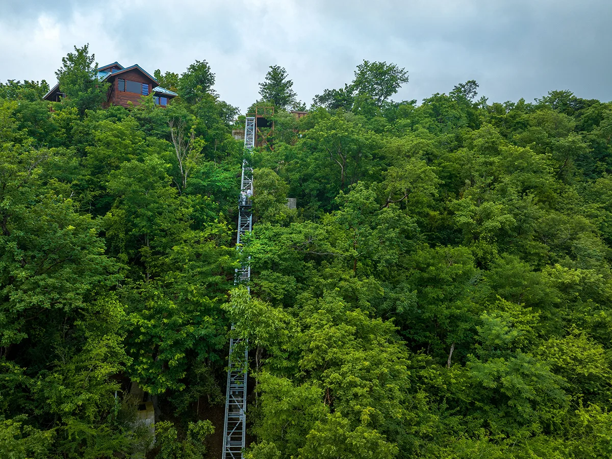 funicular with green trees and blue sky