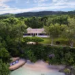 ian fleming villa with beach and green trees