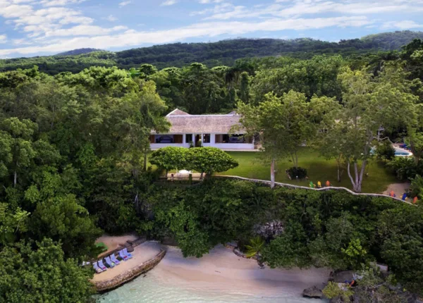 ian fleming villa with beach and green trees