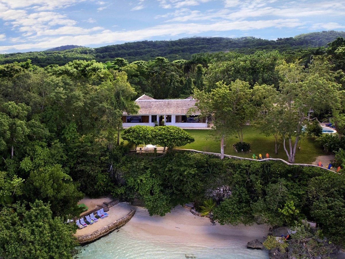 ian fleming villa with beach and green trees