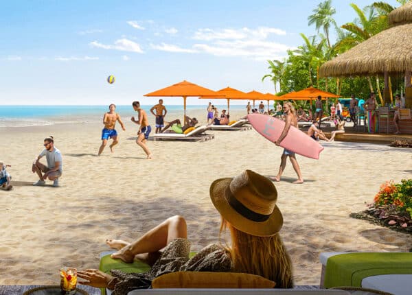 cozumel beach club with woman looking at umbrellas