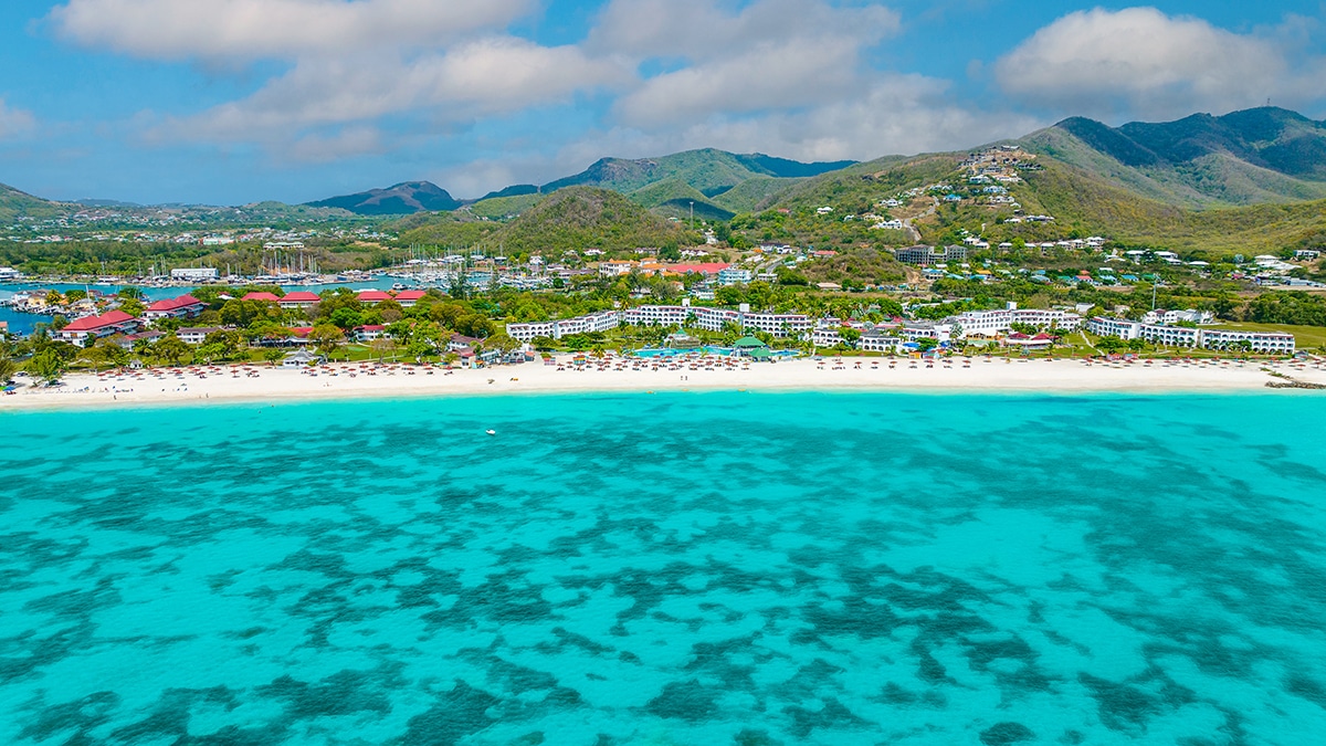 beach with blue water and white sand