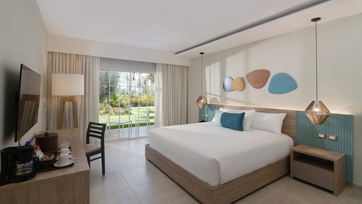 Interior of a room with a bed and blue pillows