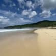 playa resaca culebra beach with green hills and clouds in blue sky