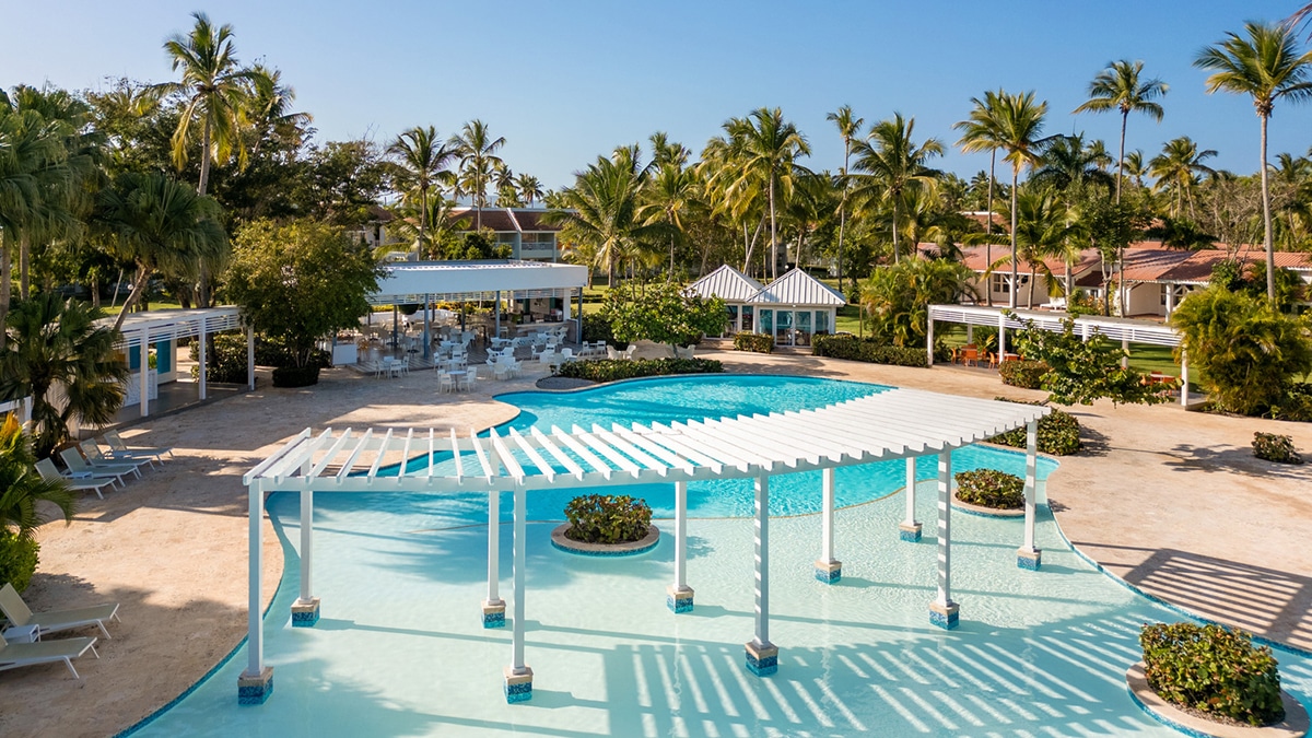 pool area with chairs and balconies