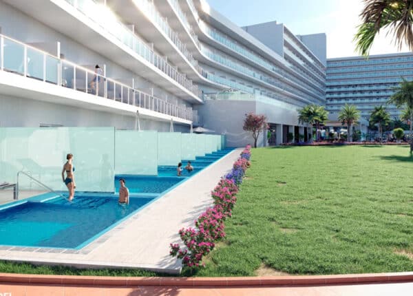 swim-up rooms with translucent walls and green lawn