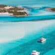 boats in turquoise water in abaco bahamas