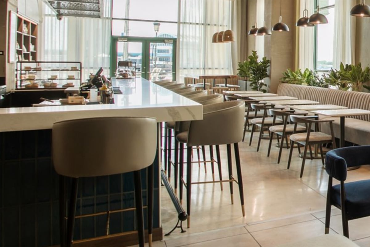 coffee bar with high stools and windows