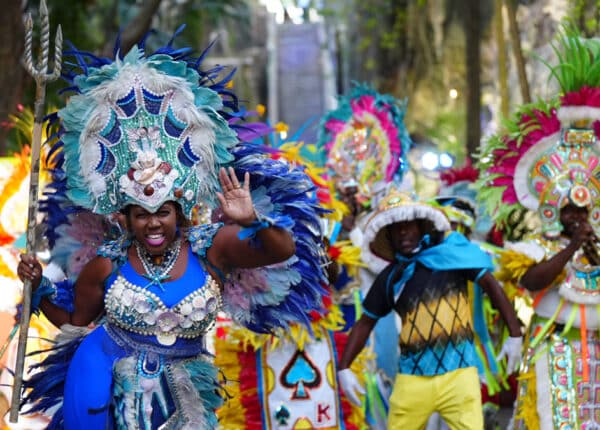 junkanoo dancers near staircase