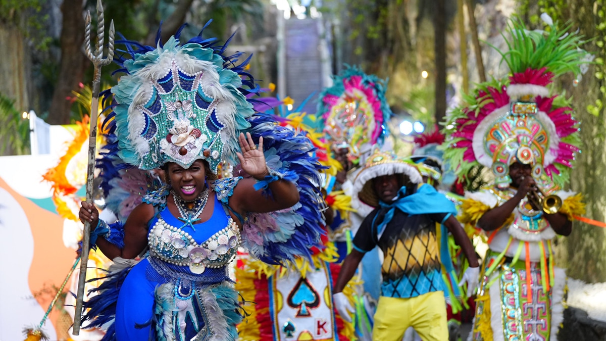 junkanoo dancers near staircase