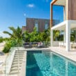 turks and caicos beach with pool next to sand