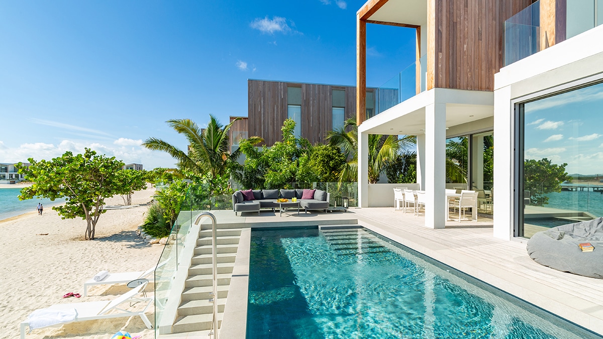 turks and caicos beach with pool next to sand