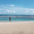 swimmer in bathing suit on beach in jamaica