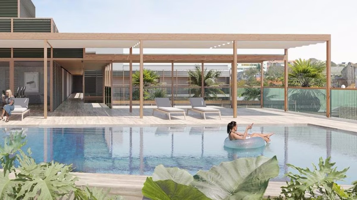 rooftop pool with woman swimming