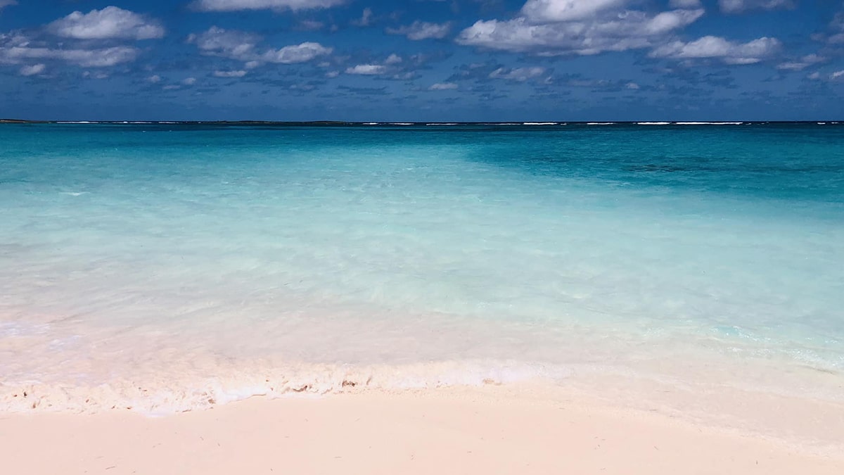 potlatch club pink sand with blue water