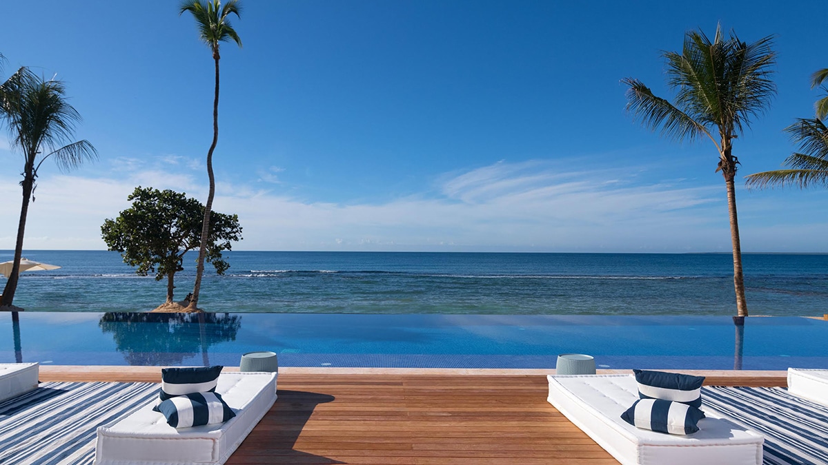 chairs on deck in front of beach
