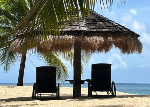 saint lucia chairs on the beach with palapa