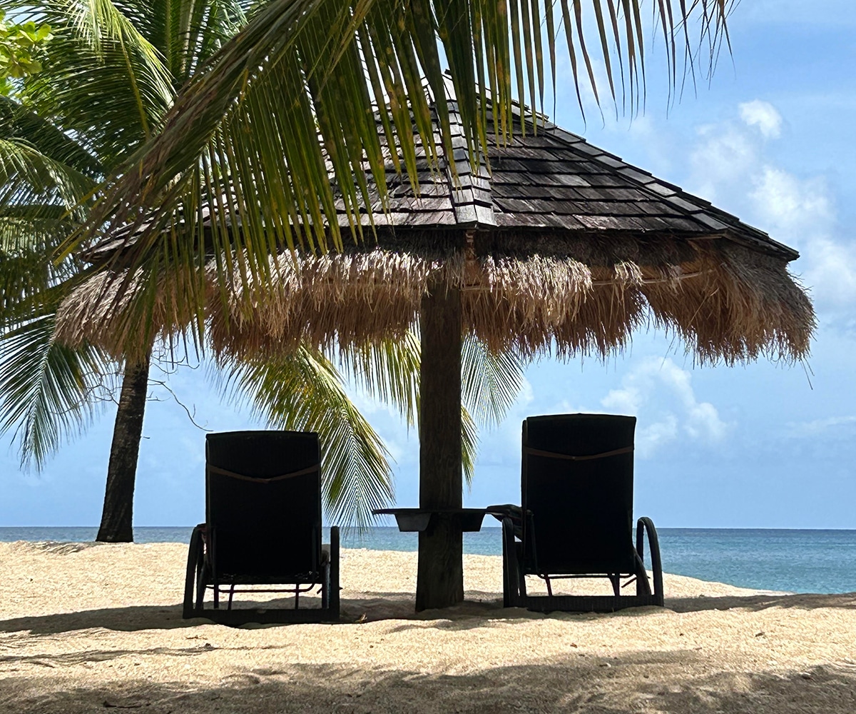 saint lucia chairs on the beach with palapa
