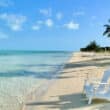 white chairs on the beach in turks and caicos