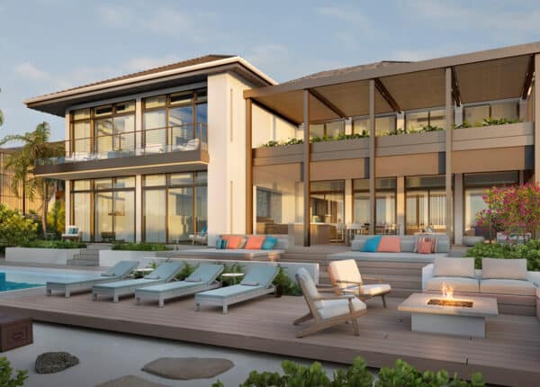 the loren villa with chairs alongside pool
