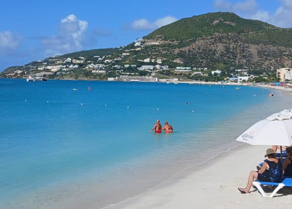 st maarten philipsburg couple in water next to sandy beach