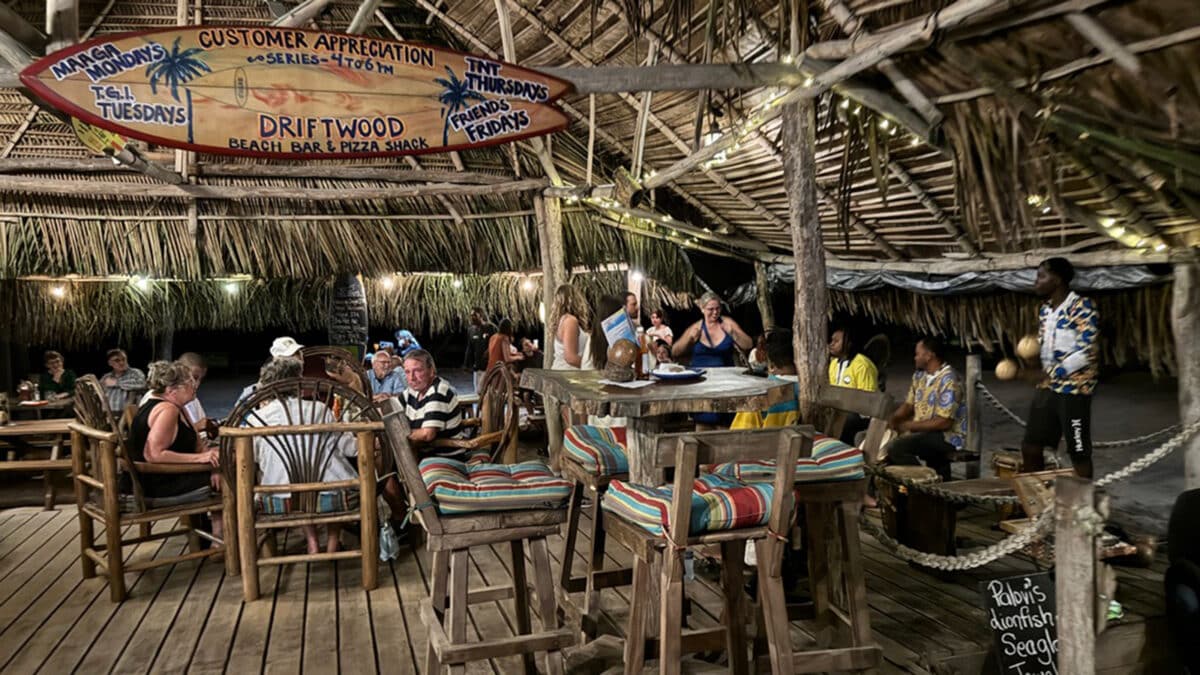 driftwood beach bar people dining at tables
